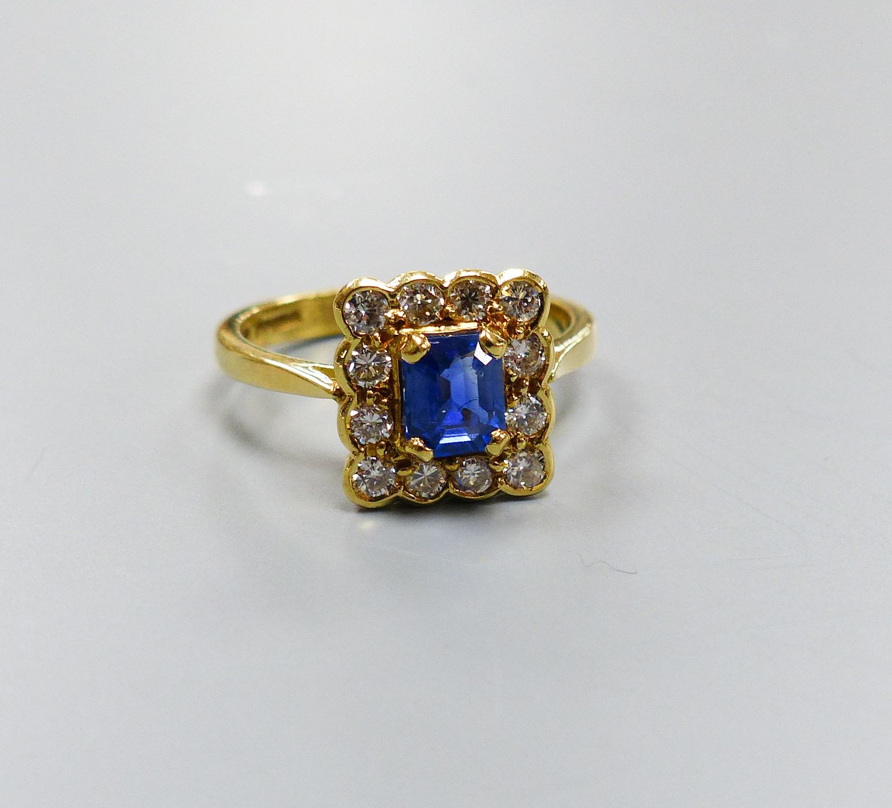 A modern 18ct gold, sapphire and diamond set square cluster ring, size M, gross weight 4.2 grams